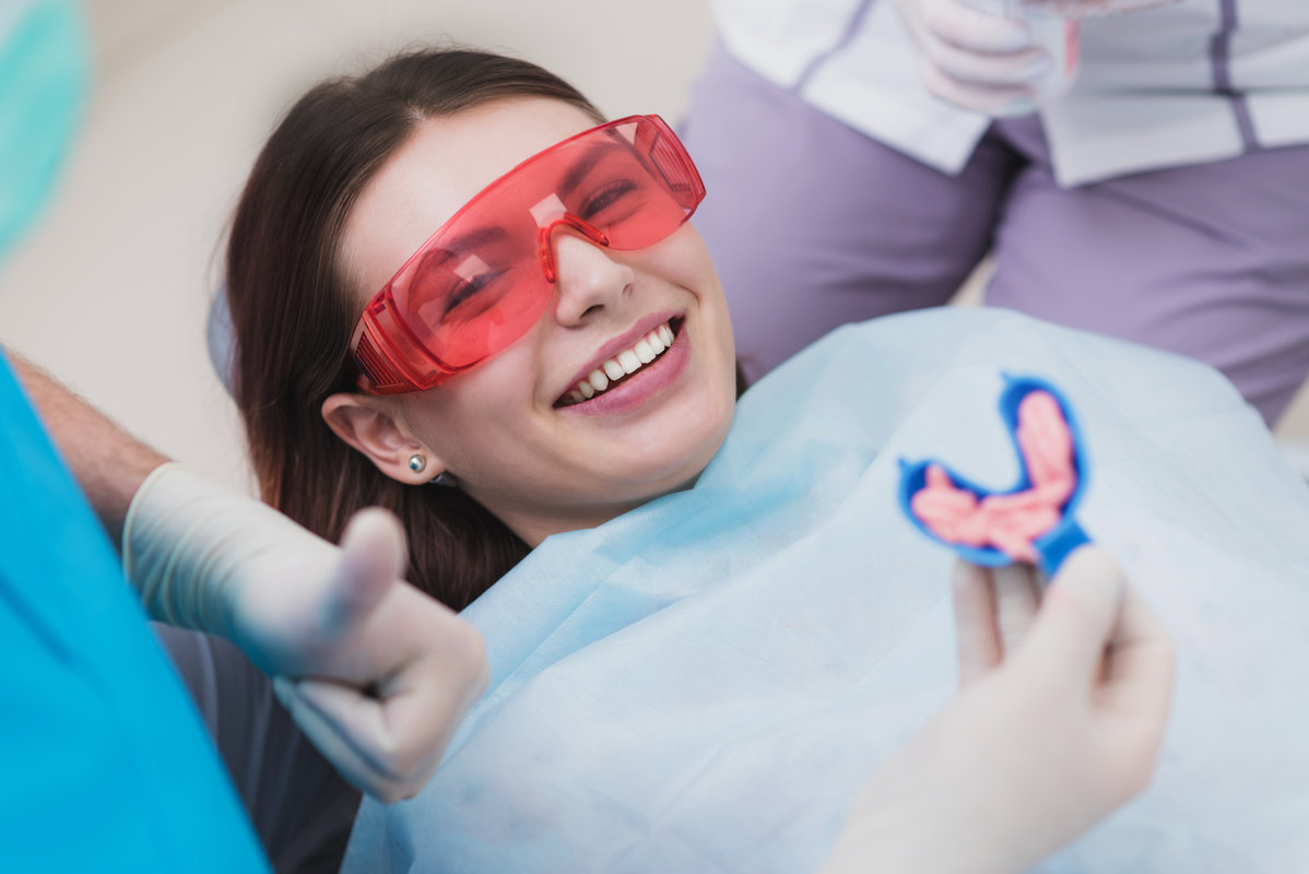doctor performs the procedure for cleaning teeth