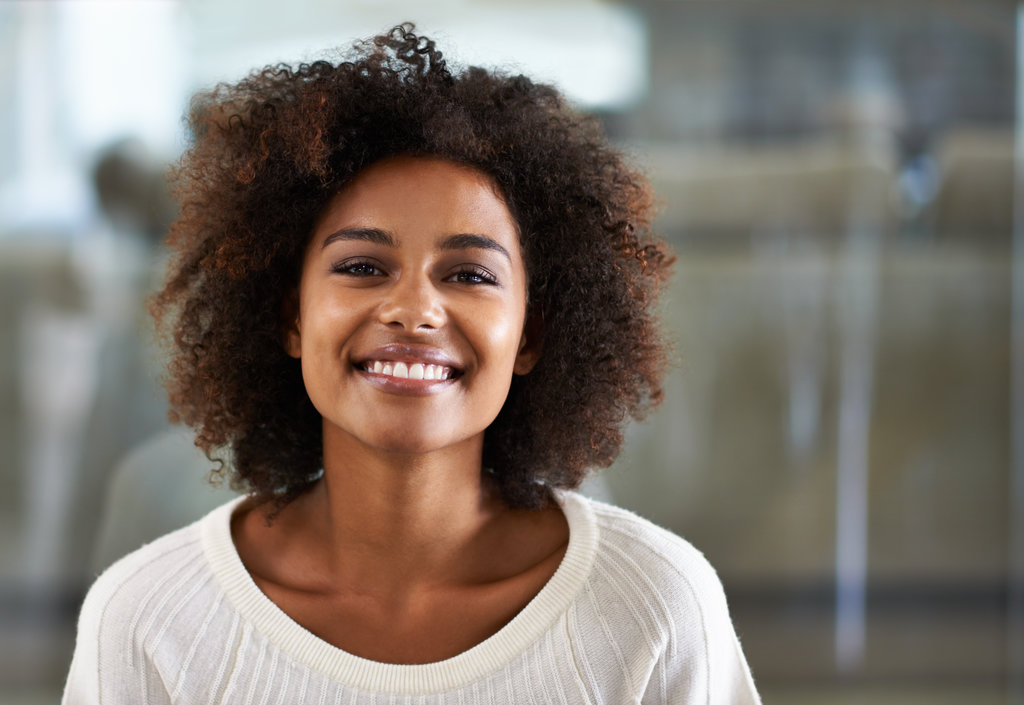 Her smile is infectious. Portrait of a smiling young woman at home.